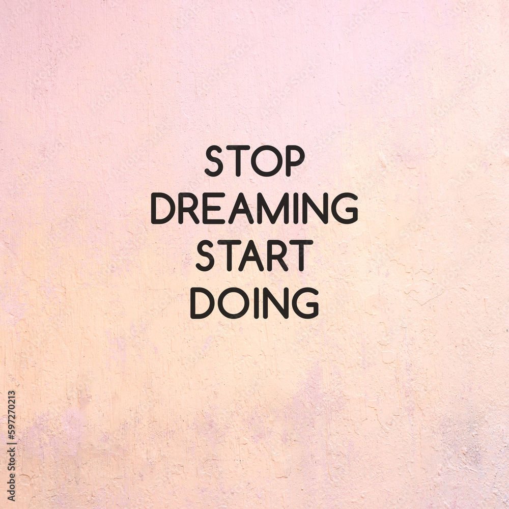 Stop Dreaming Start Doing text on concrete wall Stop Dreaming Start Doing text on concrete wall