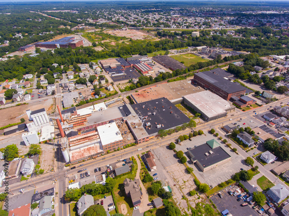 Historic mill factory aerial view on Broad Street with Blackstone River at the background in city center of Central Falls, Rhode Island RI, USA. 