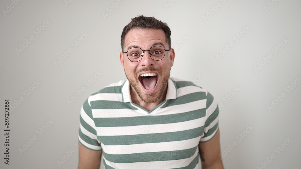 Young caucasian man standing with surprise expression over isolated white background Young caucasian man standing with surprise expression over isolated white background