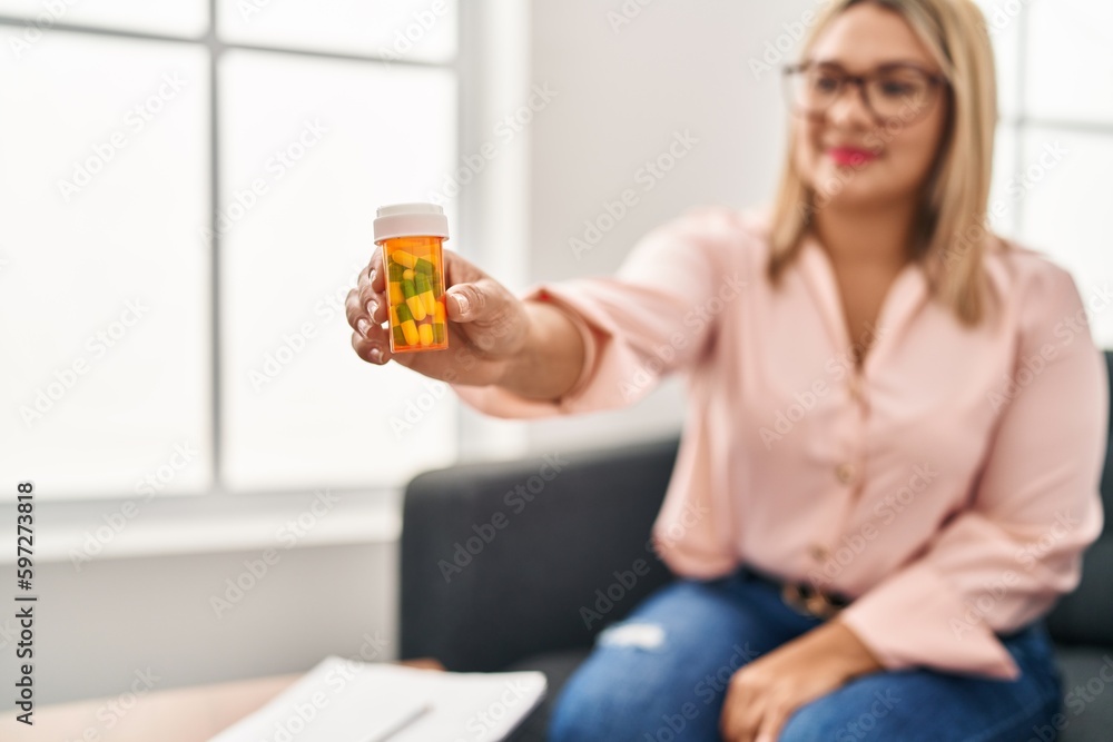 Young hispanic woman having psychology session prescribe pills psychology center Young hispanic woman having psychology session prescribe pills psychology center