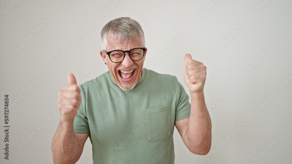 Middle age grey-haired man smiling with thumbs up over isolated white background Middle age grey-haired man smiling with thumbs up over isolated white background