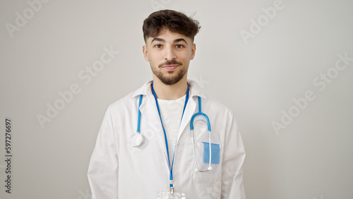 Young arab man doctor smiling confident standing over isolated white background