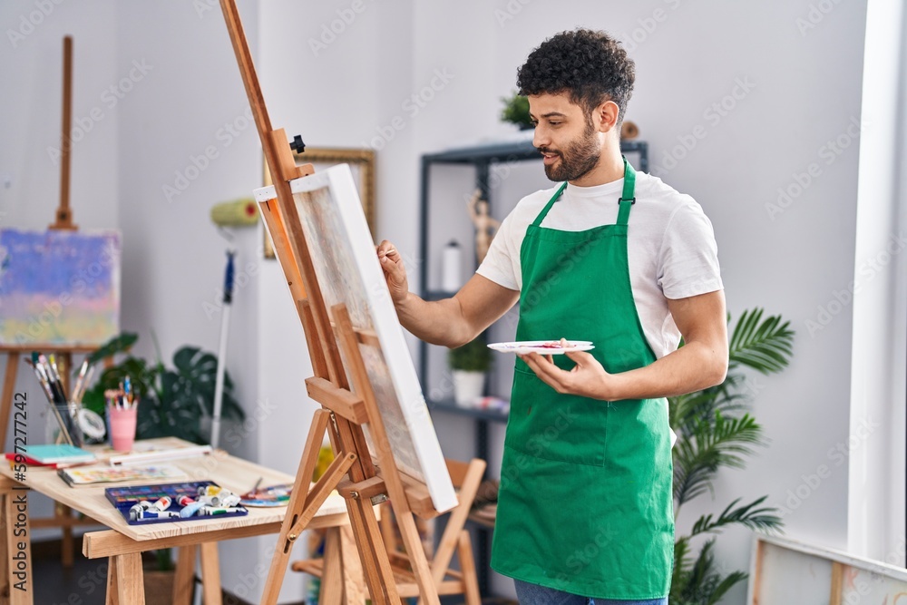 Young arab man artist smiling confident drawing at art studio Young arab man artist smiling confident drawing at art studio