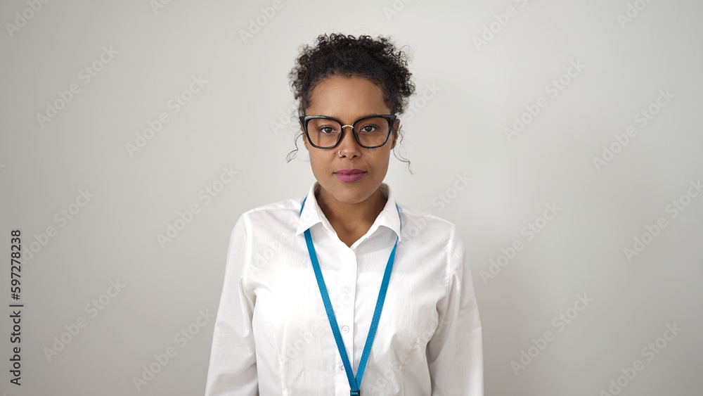 African american woman standing with relaxed expression over isolated white background African american woman standing with relaxed expression over isolated white background