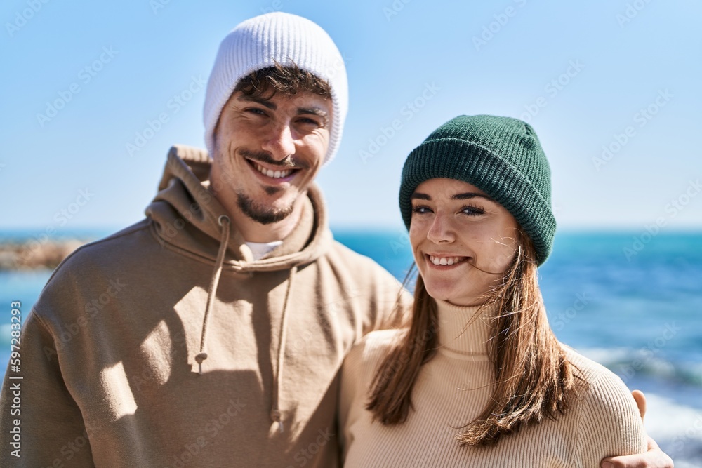 Mand and woman couple smiling confident hugging each other at seaside Mand and woman couple smiling confident hugging each other at seaside