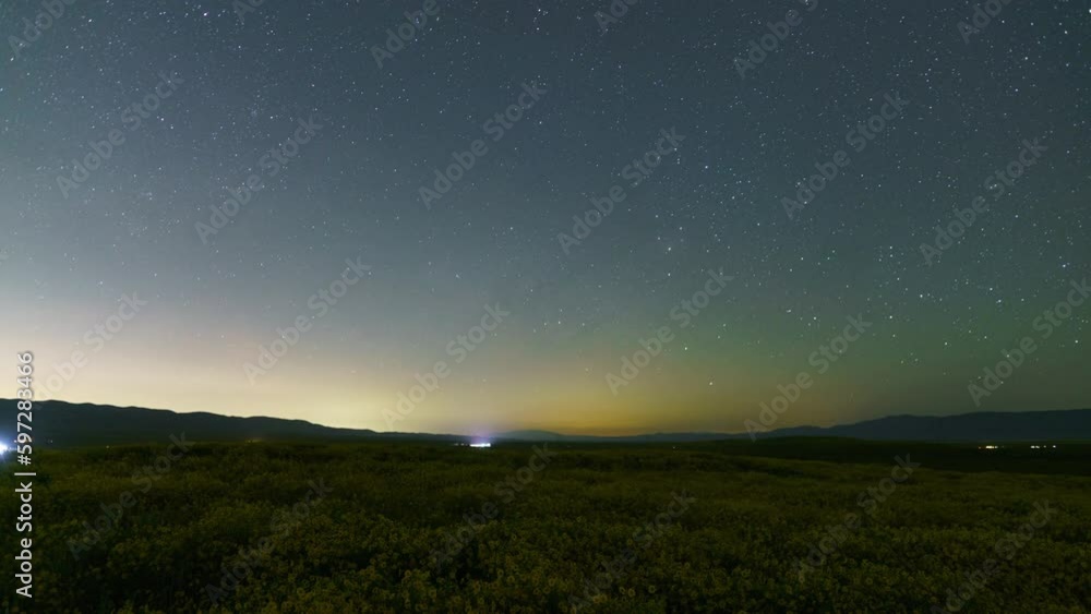 Time lapse of Milky Way galaxy over wildflower superbloom at Carrizo Plain in Southern California, USA Time lapse of Milky Way galaxy over wildflower superbloom at Carrizo Plain in Southern California, USA