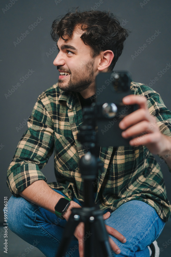 Man smiling doing an online transaltion