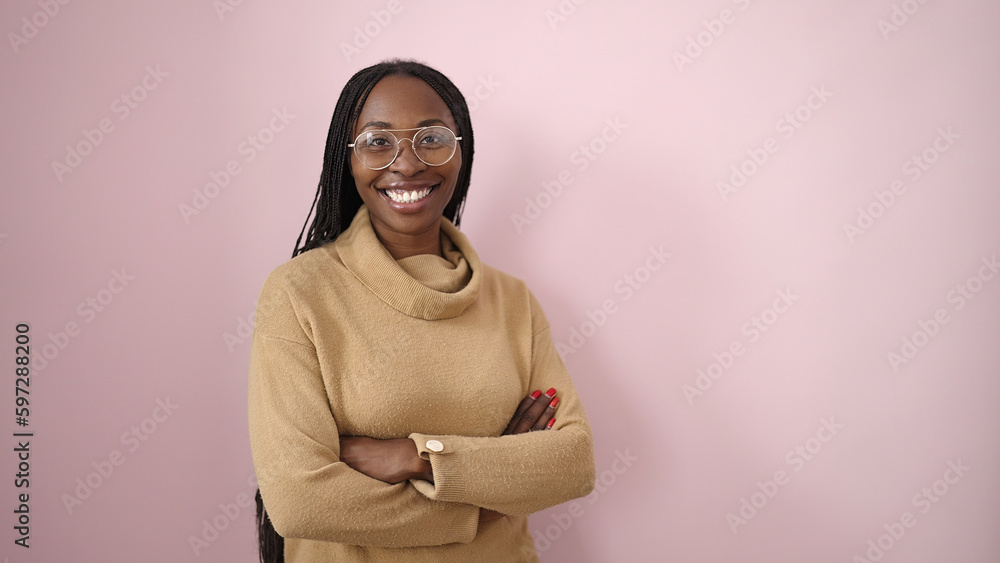 African woman smiling confident over isolated pink background African woman smiling confident over isolated pink background