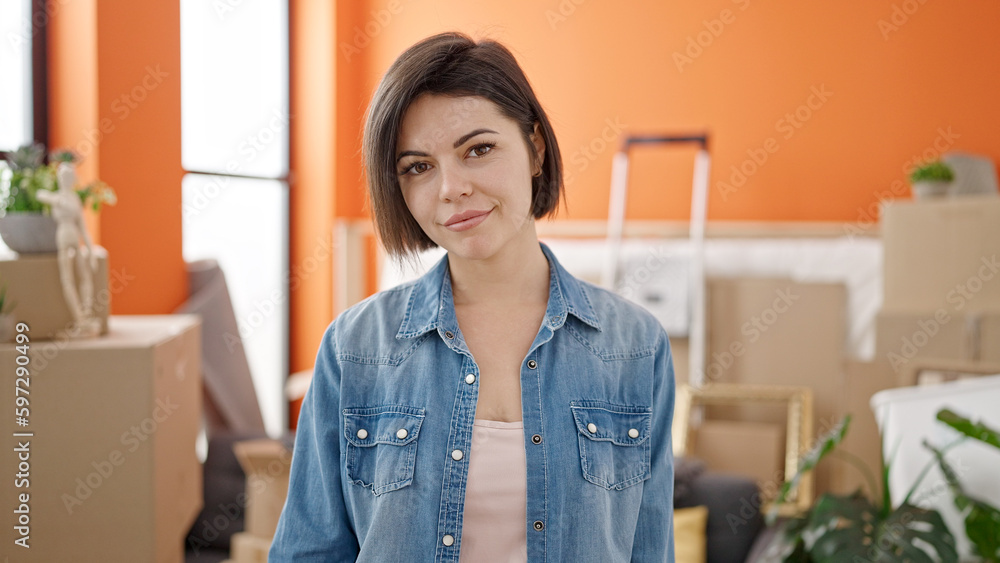 Young caucasian woman standing at new home Young caucasian woman standing at new home