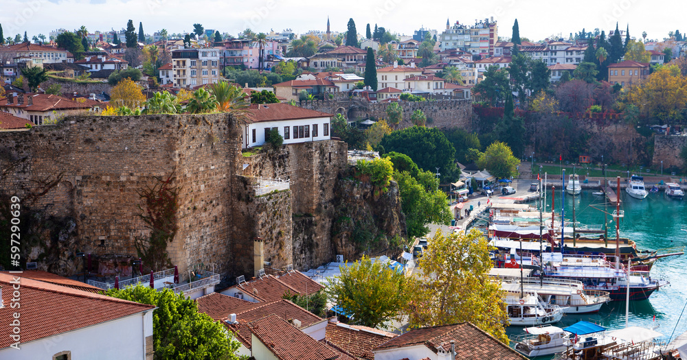 Naklejka premium The old port of Antalya - Antalya Kaleici Yat Limani. The old town. With yachts, boats. and old buildings. View from above. Antalya, Turkiye.