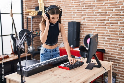 Adorable girl dj playing music session at music studio