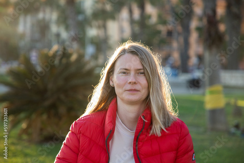 happy beautiful woman enjoying sunset in the park