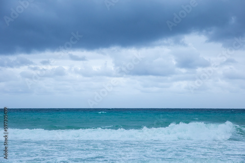 Tropical storm in the Atlantic Ocean. Beautiful rolling waves. Hurricane in Caribbean Sea, Gulf of Mexico, Cancun.