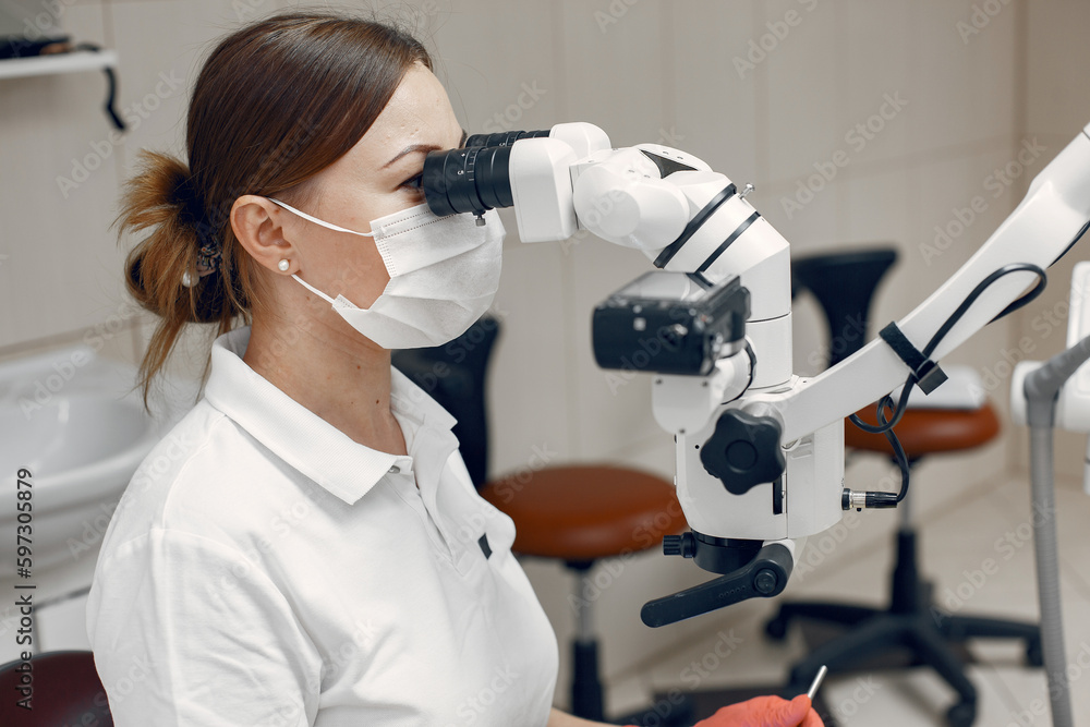 The dentist conducts an examination The dentist conducts an examination