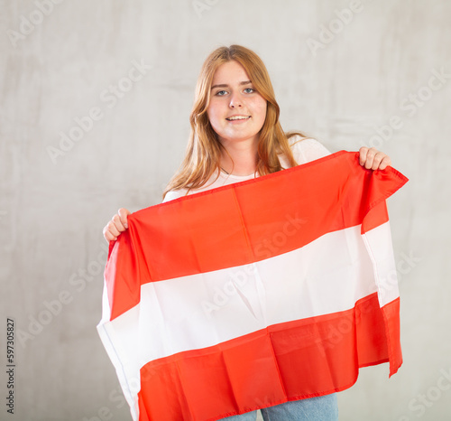Portrait of positive young girl with the flag of Austria