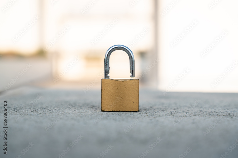 Fototapeta premium padlock security open without its keys over concrete