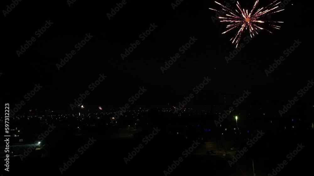 Home fireworks all over the city in celebration of the New Year. Lots of fireworks from private houses. Residents of the city launch fireworks. Home fireworks all over the city in celebration of the New Year. Lots of fireworks from private houses. Residents of the city launch fireworks.
