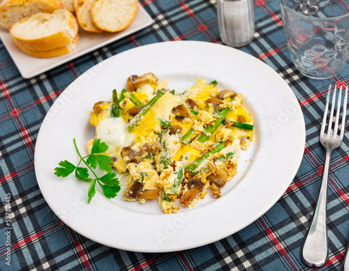 Easy vegetarian breakfast, scrambled eggs with mushrooms and asparagus