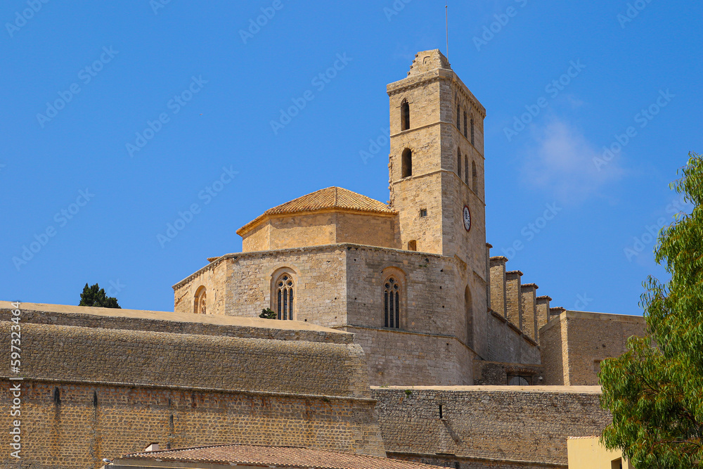 Bell tower of the Saint Mary Cathedral above the ramparts of the Castle of Eivissa in Dalt Vila, the old city center of Ibiza in the Balearic Islands, Spain