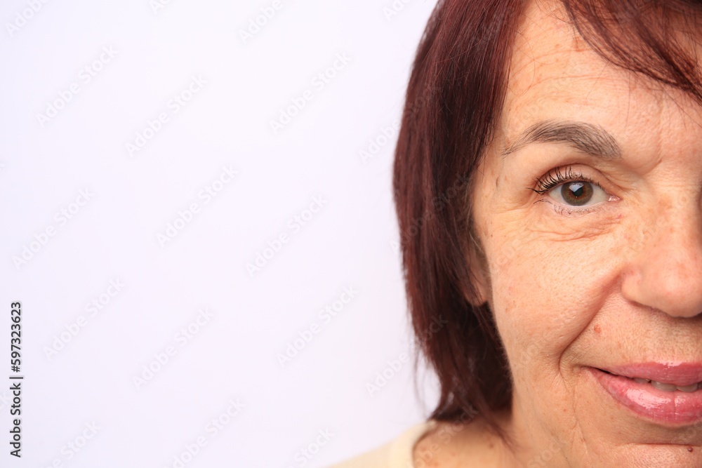 Skin care. Senior woman on white background, closeup. Space for text Skin care. Senior woman on white background, closeup. Space for text