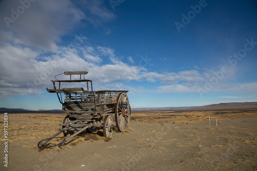 Old wagon at the entrance of a Patagonian ranch, a memory of a past of work and effort of the pioneers