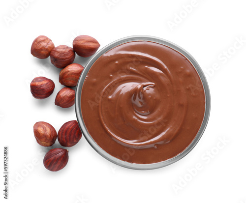 Bowl with tasty chocolate paste and nuts isolated on white, top view