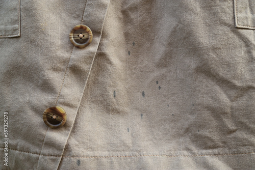 Ink stain on brown shirt from using pen in daily life. dirty stain for cleaning concept
