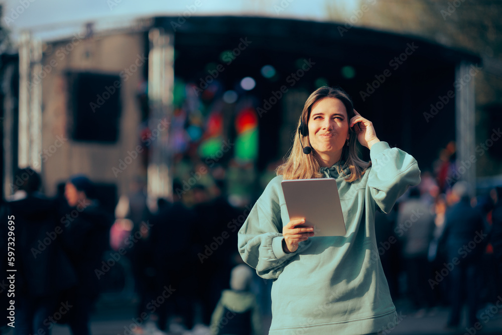 Stressed Music Festival Organizer Holding a Pc Tablet. Unhappy public relation specialist unable to make arrangements 
 - obrazy, fototapety, plakaty 
