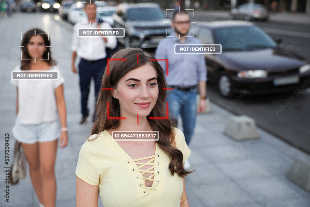 Obraz premium Facial recognition system identifying people on city street. Woman and her personal data