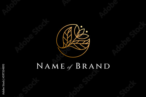 Floral logo in luxury gold color in circle shape linear design style