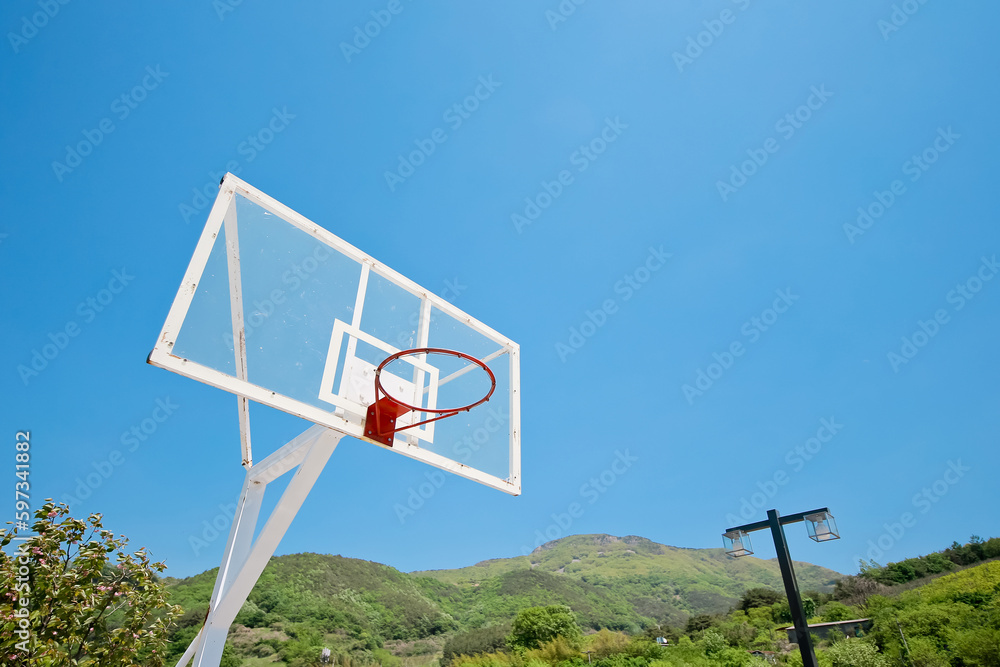 A basketball hoop without nets where black NBA players without money practiced as children