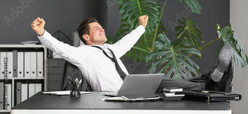 Young businessman relaxing ...