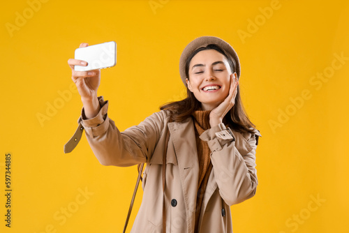 Young woman in coat with mo...