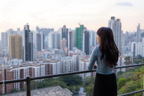 Woman enjoy the city view in Hong Kong