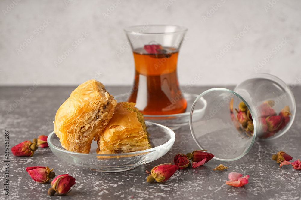 Bowl with tasty baklava on grunge background Bowl with tasty baklava on grunge background