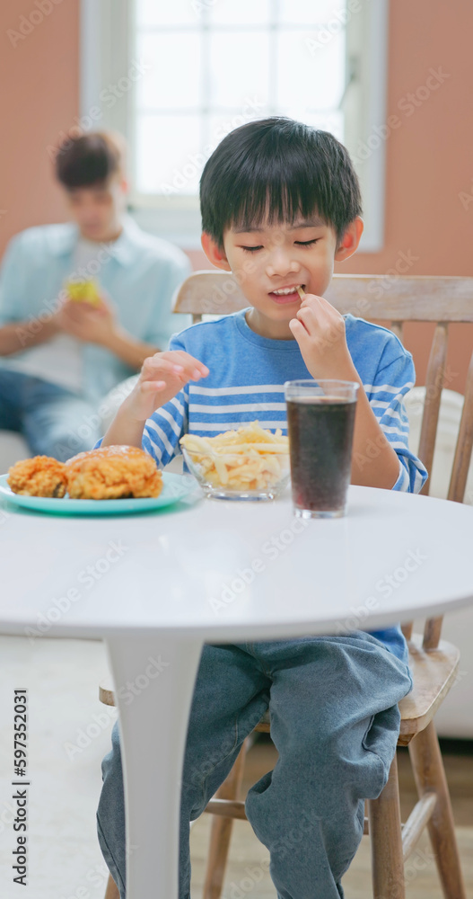 asian boy eat unhealthy food