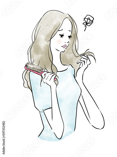 髪のダメージを気にする美しい女性