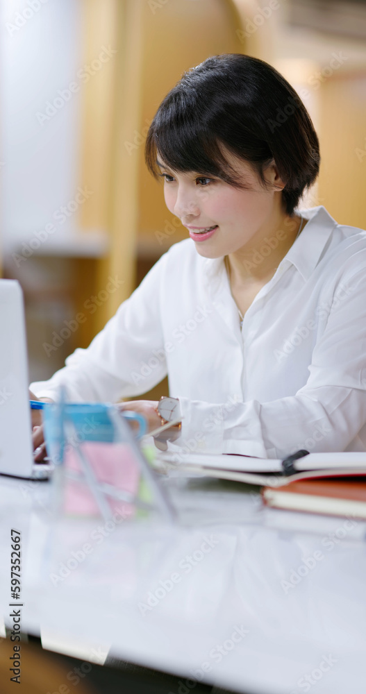 asian happy businesswoman working