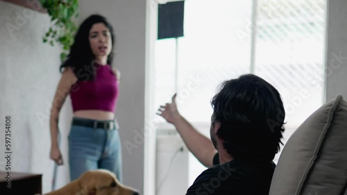 Couple fighting at home. Woman discussing relationship with her boyfriend or husband feeling frantic about relationship problems. Angry frustrated emotion of people during heated discussion
