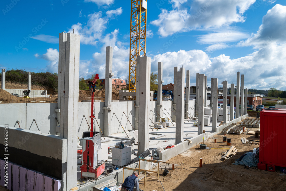 concrete pillars for a factory building are erected on a construction site concrete pillars for a factory building are erected on a construction site