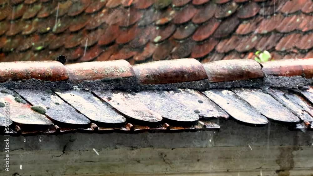 Heavy Rain Hitting Old House Roof With Missing Tiles during Thunderstorm Heavy Rain Hitting Old House Roof With Missing Tiles during Thunderstorm