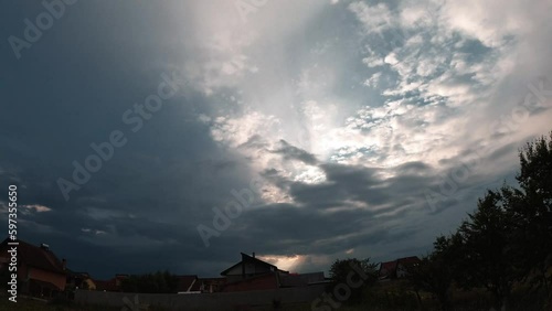 Blue sky and clouds natural background,sky and clouds with the sun. Storm Clouds Time lapse. Dark clouds block out the sun before the storm
