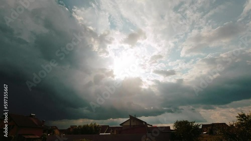 Blue sky and clouds natural background,sky and clouds with the sun. Storm Clouds Time lapse. Dark clouds block out the sun before the storm