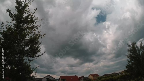 Blue sky and clouds natural background,sky and clouds with the sun. Storm Clouds Time lapse. Dark clouds block out the sun before the storm