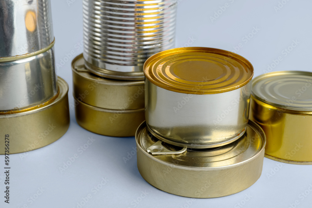 Different tin cans with fish on white background Different tin cans with fish on white background