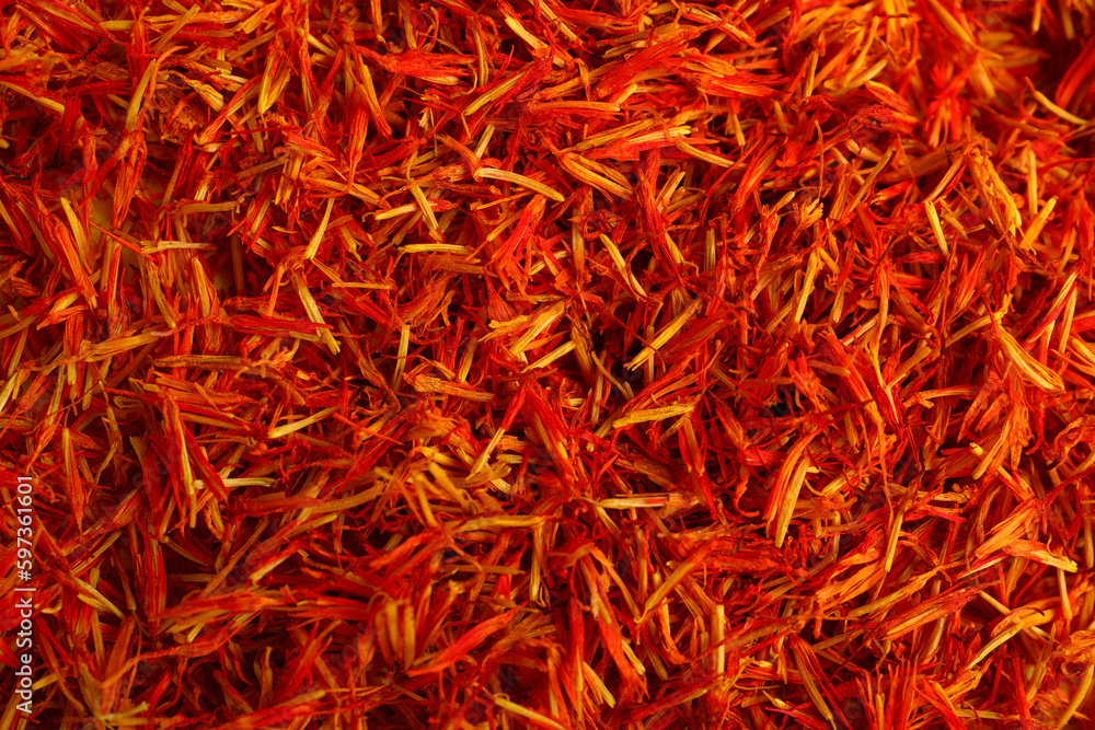 Fototapeta premium Pile of saffron as background, closeup