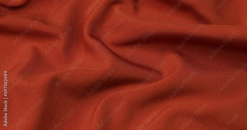 Orange fabric background. Orange cloth waves background texture. Orange fabric cloth textile material. Orange fabric background. Orange cloth waves background texture. Orange fabric cloth textile material.
