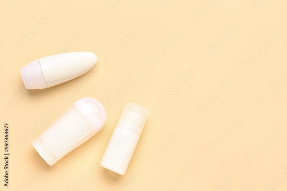 Different deodorant bottles on yellow background Different deodorant bottles on yellow background