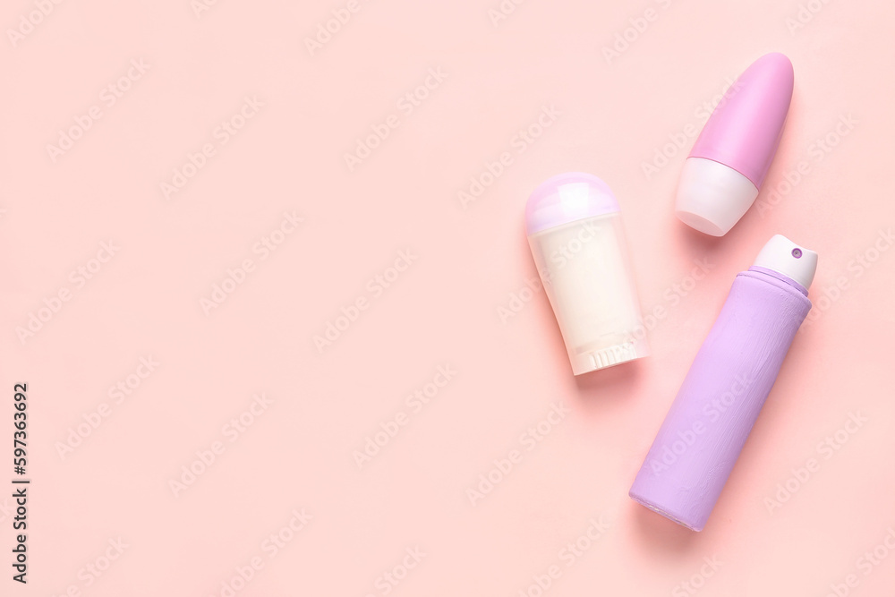 Different deodorant bottles on pink background Different deodorant bottles on pink background