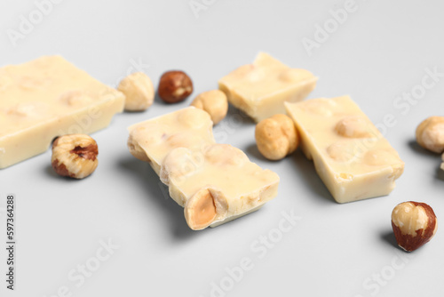 Sweet white chocolate with nuts on  light background